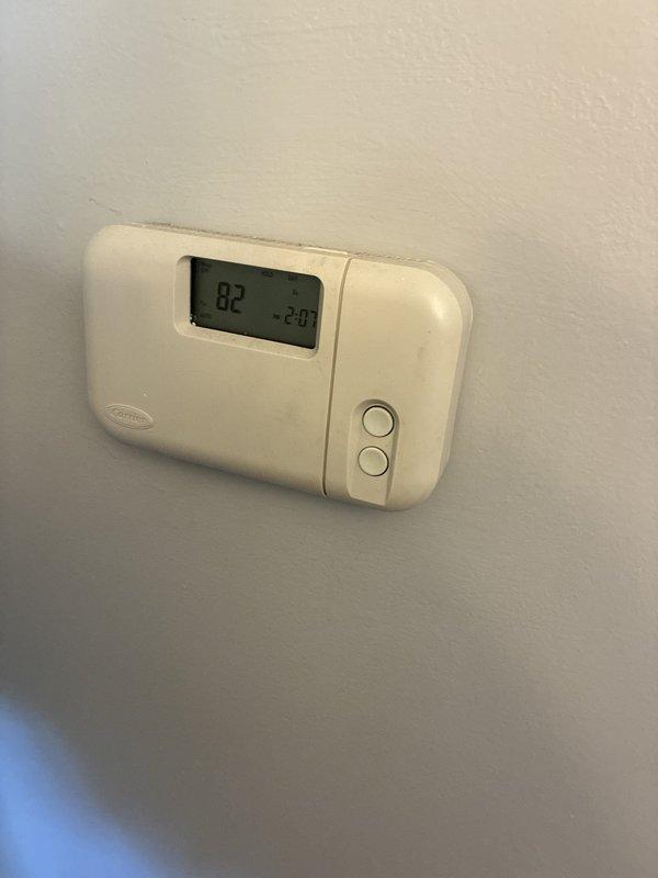 Provided HVAC system replacement estimate and options to customer requesting immediate installation. Documented existing Carrier thermostat showing current temperature reading of 82 degrees and photographed electrical panel with circuit directory identifying HVAC and furnace circuits for installation planning. Scheduled installation appointment for Monday afternoon pending customer acceptance of estimate.