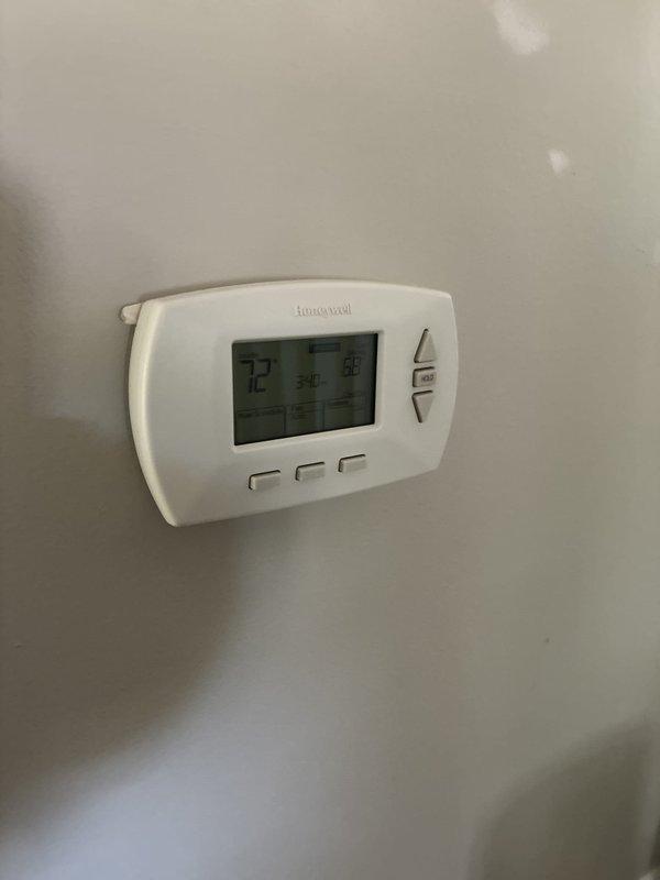 Responded to no cooling call and performed system evaluation. Upon inspection, found outdoor HVAC unit located in debris-filled equipment alcove with significant leaf accumulation affecting airflow and system performance. Assessed existing equipment condition, indoor Honeywell digital thermostat functionality, and overall system operation. Provided customer with replacement options and estimates for new HVAC system installation to resolve cooling issue and restore comfort.