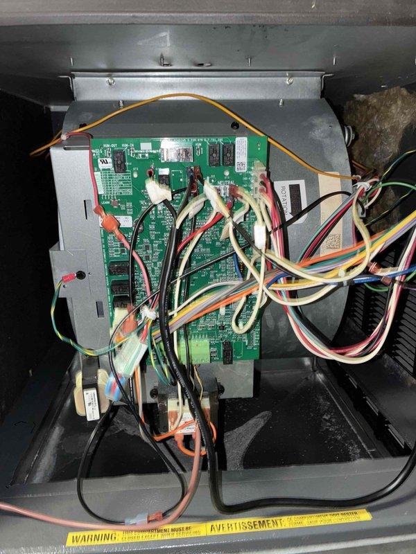 Completed scheduled preventive maintenance on residential cooling system. Performed comprehensive inspection of outdoor condensing unit and indoor control board assembly, verifying proper operation of all electrical components, connections, and control circuits. Documented system condition with photographs showing control board functionality and exterior equipment installation for maintenance records.