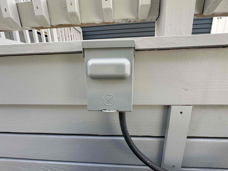 Completed routine cooling maintenance on residential heat pump system. Inspected outdoor condensing unit, electrical disconnect, and all accessible components. Verified proper operation of unit mounted on vibration-dampening pad with adequate clearance from building structure. Confirmed electrical connections at disconnect box secure, refrigerant lines intact, and unit operating within normal parameters for seasonal cooling performance.