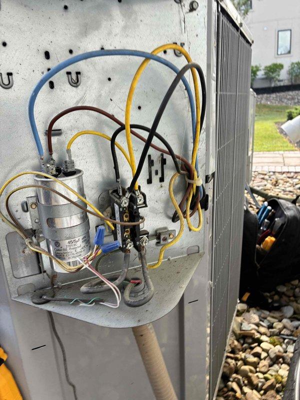 Completed scheduled preventive maintenance on two outdoor HVAC cooling systems. Performed comprehensive inspection of electrical components including capacitors, contactors, and wiring connections on both units. Tested system operation and verified all connections were secure with no signs of electrical issues requiring immediate attention.