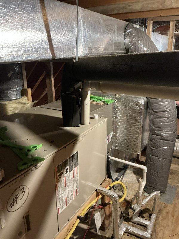 Conducted comprehensive assessment of existing HVAC system for complete replacement estimate. Evaluated attic-installed furnace and air handler unit with associated ductwork, including flexible insulated duct runs and PVC condensate piping. Presented multiple air conditioning replacement options and discussed two-furnace configuration requirements. Customer expressed interest in both standard equipment options and Trane brand alternatives, requesting time to obtain competitive quotes before making final equipment selection decision.