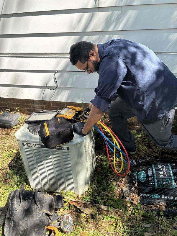 Responded to no cooling complaint on 15+ year old Trane XE1000 central air conditioning system. Connected manifold gauges to outdoor condenser unit and performed diagnostic testing to identify system malfunction. Assessed refrigerant pressures and evaluated both outdoor condensing unit and indoor air handler components to determine root cause of warm air delivery from supply registers.