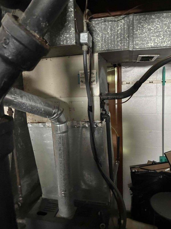 Responded to no cooling complaint on 15+ year old Trane XE1000 central air conditioning system. Connected manifold gauges to outdoor condenser unit and performed diagnostic testing to identify system malfunction. Assessed refrigerant pressures and evaluated both outdoor condensing unit and indoor air handler components to determine root cause of warm air delivery from supply registers.