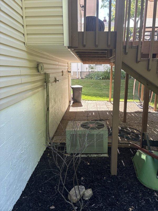 Completed comprehensive estimate for HVAC system and water heater replacement in residential property being prepared for sale. Evaluated existing gas furnace with Space-Gard filtration system, cylindrical water heater, and outdoor air conditioning condenser unit located beneath deck structure. Provided equipment replacement options and pricing information to enhance property marketability for upcoming home sale.