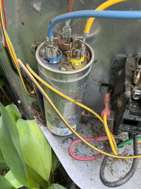 Completed cooling season tune-up on HVAC system. Inspected and tested capacitor functionality, verified proper electrical connections, and measured system amperage readings at 0.183A with 224V supply voltage. All components operating within normal parameters.