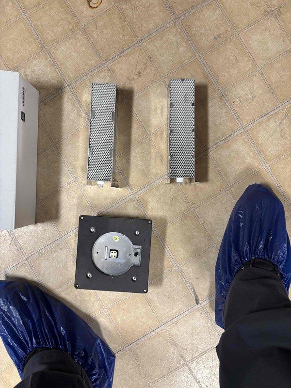 Returned to complete installation of humidifier system and replacement of air scrubber UV bulbs. Installed new mesh pre-filters and mounted air purification components to existing HVAC system, ensuring proper electrical connections and secure mounting of all hardware.