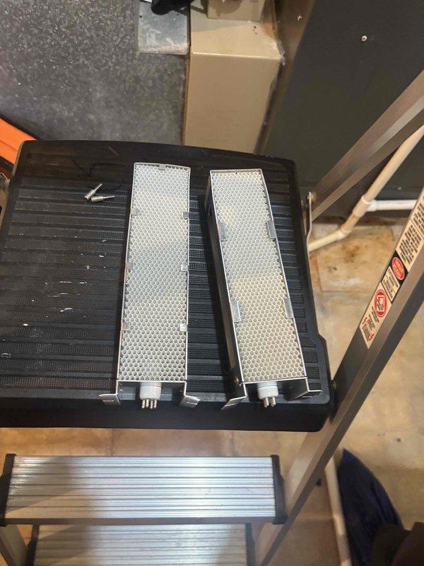 Returned to complete installation of humidifier system and replacement of air scrubber UV bulbs. Installed new mesh pre-filters and mounted air purification components to existing HVAC system, ensuring proper electrical connections and secure mounting of all hardware.
