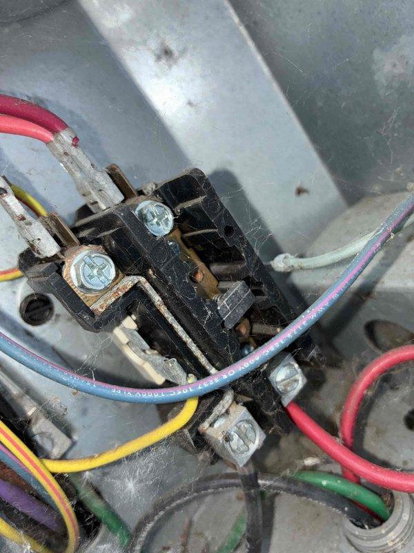 Completed scheduled preventive maintenance on residential cooling system. Performed comprehensive inspection of electrical connections at contactor assembly, noting oxidation on copper terminals and dust accumulation on terminal blocks. Inspected air filtration system, observing moderate to heavy particulate loading with uneven discoloration patterns indicating filter nearing end of service life. All electrical connections verified secure, system operational parameters confirmed within manufacturer specifications.