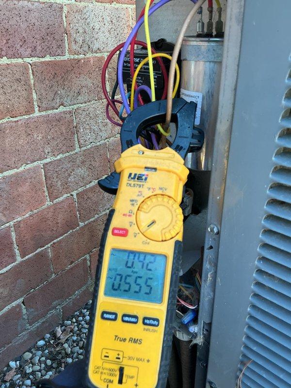 Performed routine HVAC cooling system maintenance on outdoor condensing unit. Conducted comprehensive electrical diagnostics using digital multimeter, measuring voltage at disconnect box which indicated 242V supply and verifying amperage draws on system components reading approximately 29.8-30.84 amps. Inspected capacitor, wiring connections, and electrical components. Customer declined recommended electrical repairs at this time.