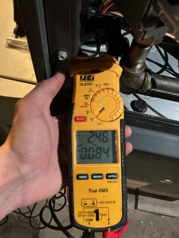 Performed routine HVAC cooling system maintenance on outdoor condensing unit. Conducted comprehensive electrical diagnostics using digital multimeter, measuring voltage at disconnect box which indicated 242V supply and verifying amperage draws on system components reading approximately 29.8-30.84 amps. Inspected capacitor, wiring connections, and electrical components. Customer declined recommended electrical repairs at this time.