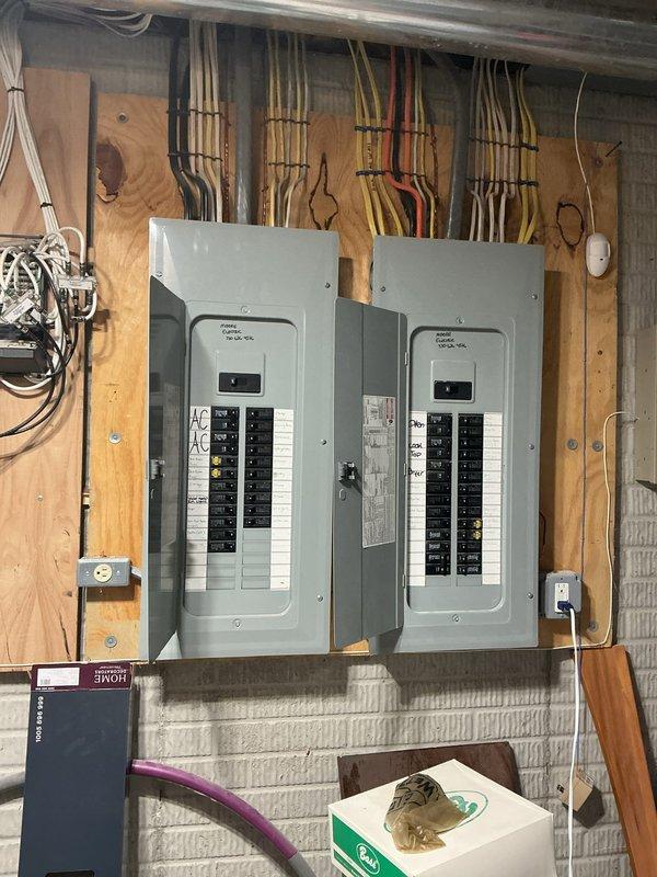 Responded to customer report of sparking at front light switch. Upon arrival, performed comprehensive electrical inspection including main service panels and affected switch circuit. Inspected dual breaker panels, verified proper circuit protection and wiring connections throughout electrical distribution system. Removed and examined faulty light switch, identifying worn internal contacts causing arcing condition. Replaced defective switch with new residential-grade toggle switch, verified secure wire terminations, and tested operation to ensure proper function without sparking. All work completed to code standards with no further electrical hazards detected.