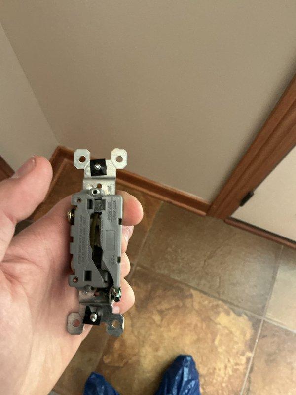 Responded to customer report of sparking at front light switch. Upon arrival, performed comprehensive electrical inspection including main service panels and affected switch circuit. Inspected dual breaker panels, verified proper circuit protection and wiring connections throughout electrical distribution system. Removed and examined faulty light switch, identifying worn internal contacts causing arcing condition. Replaced defective switch with new residential-grade toggle switch, verified secure wire terminations, and tested operation to ensure proper function without sparking. All work completed to code standards with no further electrical hazards detected.