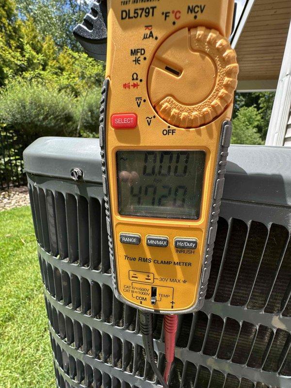 Completed scheduled cooling system maintenance on residential air conditioning unit. Performed comprehensive inspection of outdoor condensing unit, verified electrical parameters using digital multimeter, and measured system temperatures with calibrated digital thermometer recording 69.8°F. All components operating within normal specifications and unit functioning properly for continued cooling season operation.
