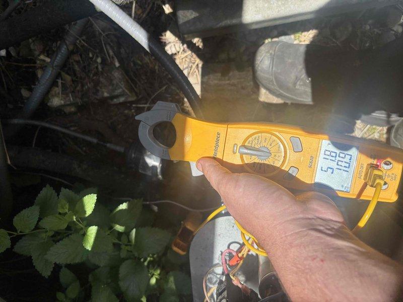 Completed routine cooling system maintenance as part of ongoing service plan. Performed electrical diagnostics using clamp meter and multimeter to verify proper amperage draw and capacitor performance, with readings indicating system operating within manufacturer specifications. Inspected outdoor condensing unit components, tested electrical connections, and confirmed all equipment functioning properly for optimal cooling season performance.