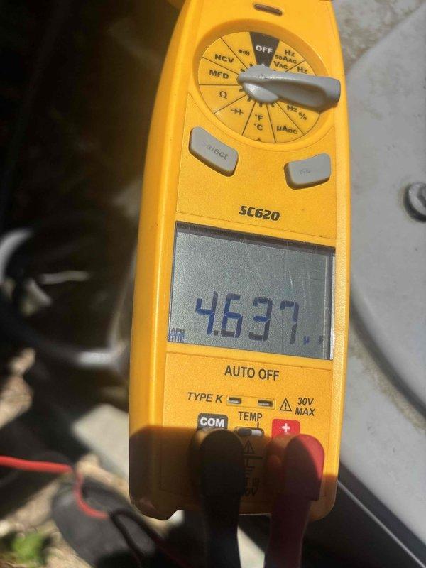 Completed routine cooling system maintenance as part of ongoing service plan. Performed electrical diagnostics using clamp meter and multimeter to verify proper amperage draw and capacitor performance, with readings indicating system operating within manufacturer specifications. Inspected outdoor condensing unit components, tested electrical connections, and confirmed all equipment functioning properly for optimal cooling season performance.