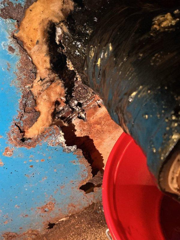 Responded to service call for aging boiler system with reported leak. Upon arrival, conducted thorough inspection and documented extensive corrosion throughout boiler components and associated piping. Found severe rust damage on multiple pipe sections, deteriorated insulation material, and compromised structural integrity of metal surfaces. Corrosion patterns indicated prolonged moisture exposure and age-related deterioration affecting both the unit's piping infrastructure and mounting surfaces. Photographed damaged areas showing flaking rust, peeling protective coatings, and compromised pipe insulation for documentation purposes. Advised customer that the boiler system has reached end of service life and requires replacement due to extensive corrosion and active leak condition presenting safety concerns.