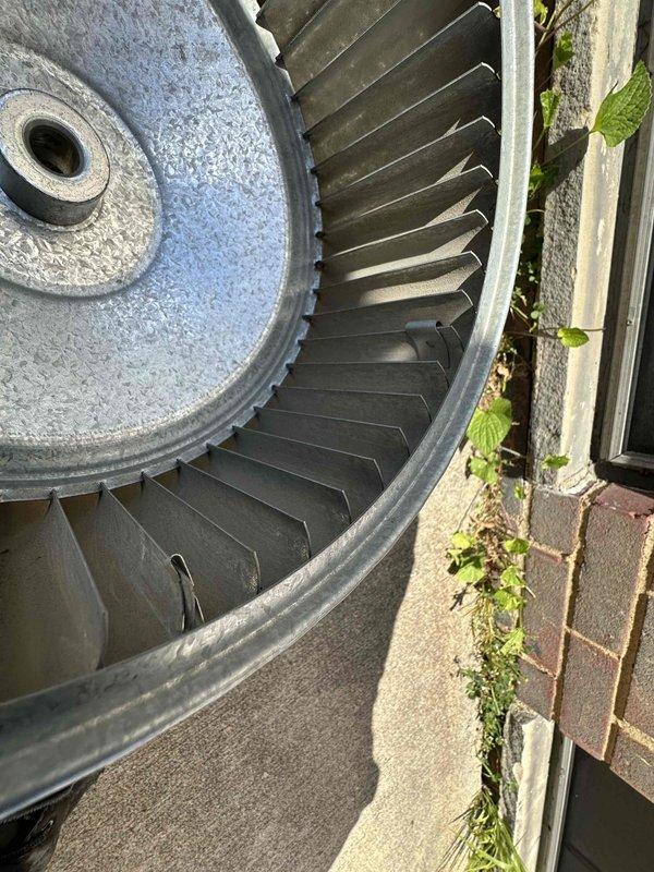Performed blower wheel cleaning service on residential HVAC system. Disassembled and removed blower assembly from air handler unit, exposing squirrel cage blower wheel and motor components. Thoroughly cleaned blower wheel to remove accumulated dust and debris that was restricting airflow and reducing system efficiency. Reassembled unit and restored system to proper operation.