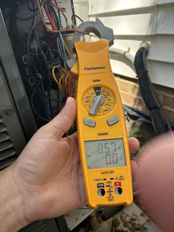 Completed comprehensive cooling maintenance on residential HVAC system, including electrical diagnostics using clamp meter to verify proper amperage and voltage readings on compressor circuit. Addressed customer concerns regarding dehumidifier noise and replaced air filter as requested. Inspected capacitor, wiring connections, and all major electrical components within condensing unit, confirming system operating within normal parameters at 0.57A draw.