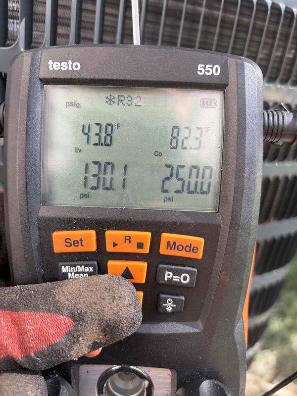 Completed installation of new air conditioning system in residential property. Installed outdoor condensing unit and connected to existing furnace with new refrigerant lines. System charged with R-32 refrigerant and verified proper operating pressures at 130.1 psi suction and 254.0 psi discharge, with evaporator temperature reading 43.8°F and condensing temperature at 82.3°F. All connections tested and system operating within manufacturer specifications.