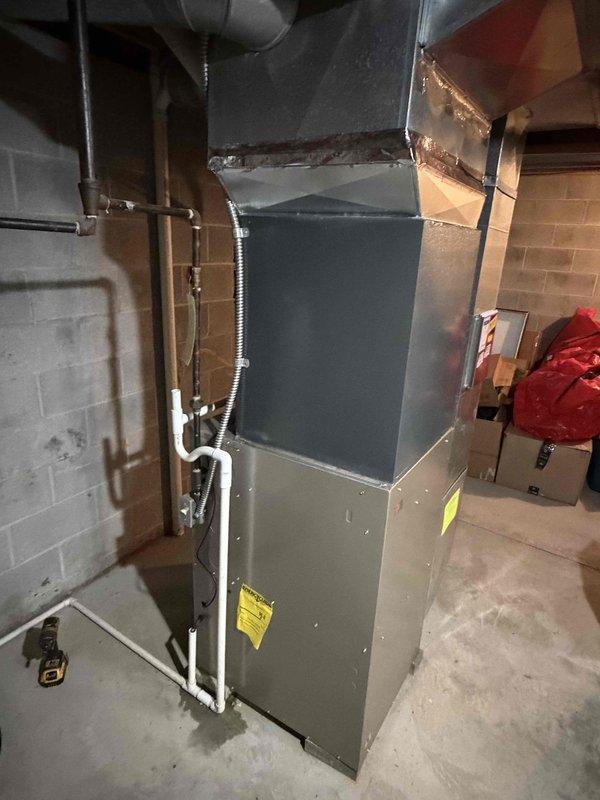 Completed installation of new air conditioning system in residential property. Installed outdoor condensing unit and connected to existing furnace with new refrigerant lines. System charged with R-32 refrigerant and verified proper operating pressures at 130.1 psi suction and 254.0 psi discharge, with evaporator temperature reading 43.8°F and condensing temperature at 82.3°F. All connections tested and system operating within manufacturer specifications.