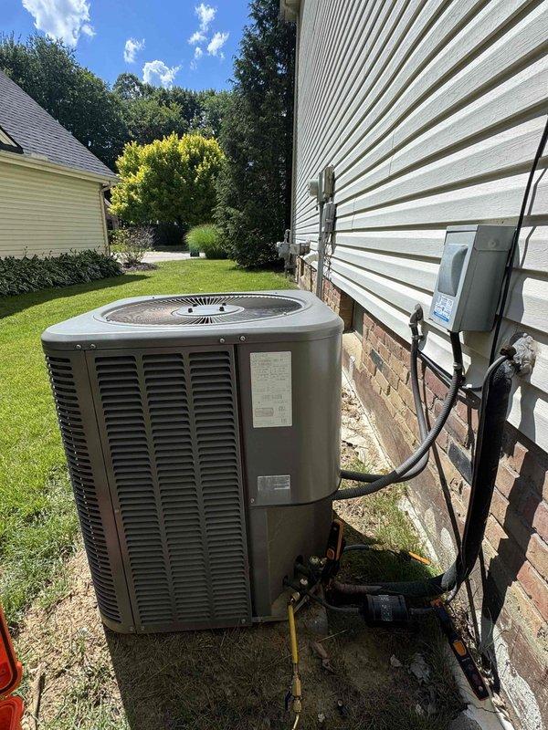 Responded to service call for potential refrigerant leak in residential air conditioning system. Performed comprehensive system inspection of outdoor condenser unit and indoor thermostat controls to identify leak source and assess overall system condition. Documented equipment condition with photographs showing Honeywell thermostat operation and exterior condensing unit installation with refrigerant line routing.