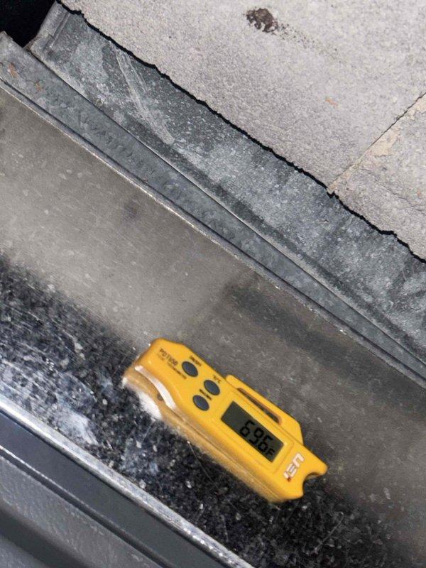 Performed annual preventative maintenance inspection on residential air conditioning system. Conducted comprehensive system evaluation including electrical measurements using clamp meter to verify proper amperage draw and operational efficiency. Inspected condensate drain pan and drainage system, noting active moisture accumulation and debris presence. Verified temperature differential readings at 85.9°F. Examined structural components surrounding unit, observing age-related wear including crack formation in concrete pad. Assessed all accessible mechanical components for proper operation. System operational at time of service completion.