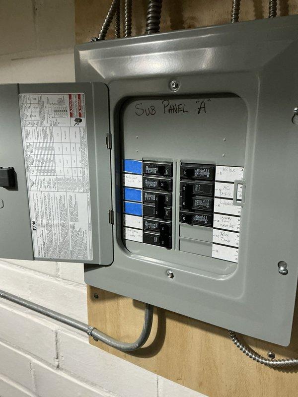 Conducted on-site evaluation for mini split installation options. Assessed existing electrical infrastructure including main panel and Sub Panel 'A', documenting current circuit breaker configuration and available capacity to determine feasibility and requirements for mini split system integration. Photographed electrical panels to support equipment sizing recommendations and installation planning.