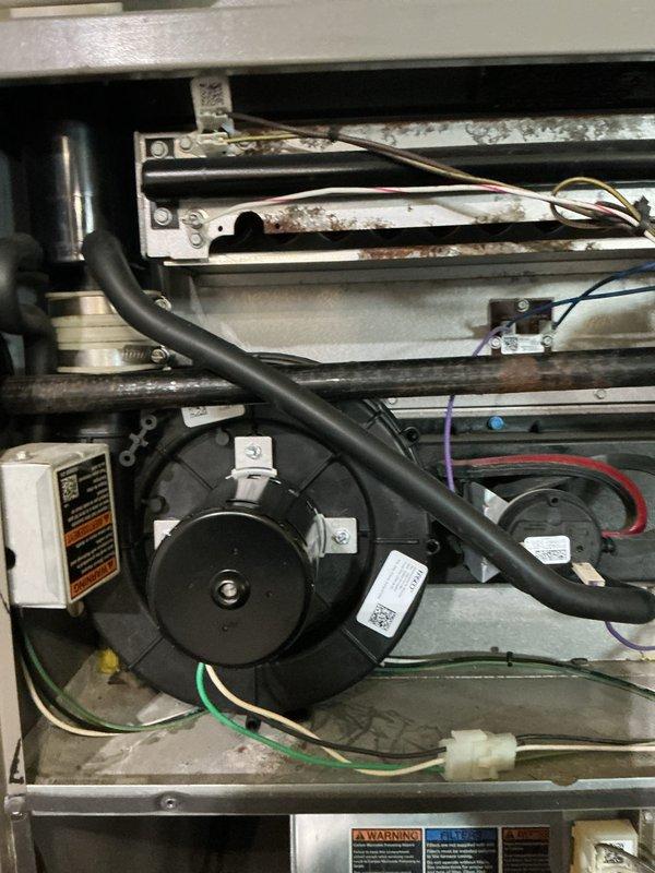 Returned to complete inducer motor replacement on furnace unit. Removed failed inducer assembly, installed new motor with proper mounting hardware and electrical connections, and verified all wiring terminals were secure. System tested successfully with proper draft operation confirmed.
