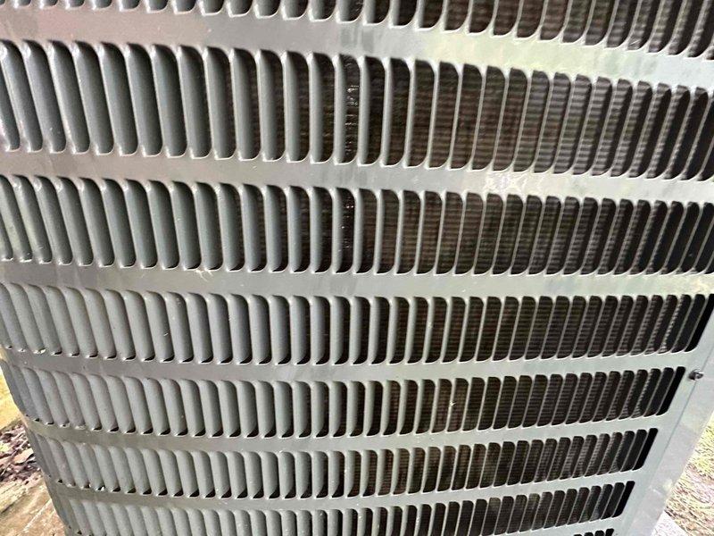 Completed scheduled cooling maintenance on outdoor condenser unit. Unit exterior was found heavily coated with accumulated dirt, debris, and dust that had significantly obstructed airflow through the protective grille and condenser coils. Thoroughly rinsed and cleaned condenser coils and exterior housing to remove all buildup and restore proper airflow capacity. Unit returned to normal operational condition with improved heat transfer efficiency.