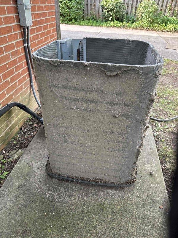 Completed scheduled cooling maintenance on outdoor condenser unit. Unit exterior was found heavily coated with accumulated dirt, debris, and dust that had significantly obstructed airflow through the protective grille and condenser coils. Thoroughly rinsed and cleaned condenser coils and exterior housing to remove all buildup and restore proper airflow capacity. Unit returned to normal operational condition with improved heat transfer efficiency.