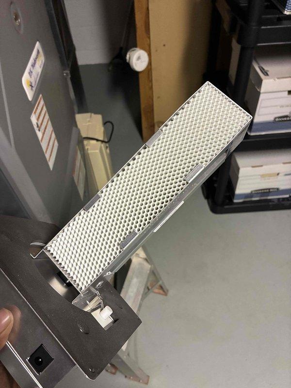 Returned to site to replace defective air scrubber UV bulb as scheduled. Removed existing contaminated filter assembly from air purification unit, installed new UV lamp component, and reassembled system to restore proper air sanitization functionality.