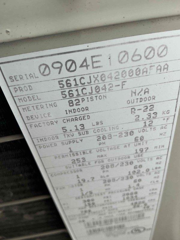 Provided HVAC replacement options for existing Carrier system with R-22 refrigerant. Documented current indoor unit (Model 561CJ042-F) and assessed system condition in basement mechanical room. Customer previously had companion AC unit replaced last June and is now evaluating replacement options for this secondary system.