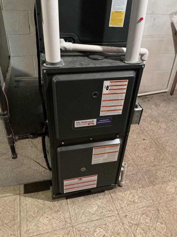 Completed scheduled cooling maintenance on residential HVAC system. Performed standard tune-up procedures including inspection of furnace unit, electrical connections, Aprilaire humidifier control, and associated components. All equipment found operating within normal parameters with proper ventilation and drainage systems intact.
