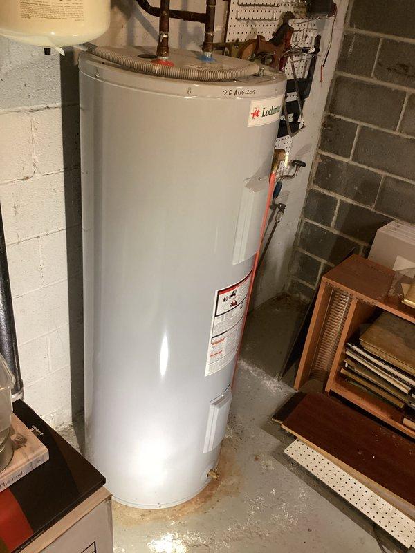 Conducted on-site evaluation for residential water heater replacement. Assessed existing installation including 2015-vintage water heater, AMTROL expansion tank, copper supply lines with isolation valves, pressure relief components, and corrugated flexible connector at base. Documented current plumbing configuration with brass fittings, pressure gauge, and foam pipe insulation on vertical runs. Provided estimate for new water heater installation with expedited service requested by customer.