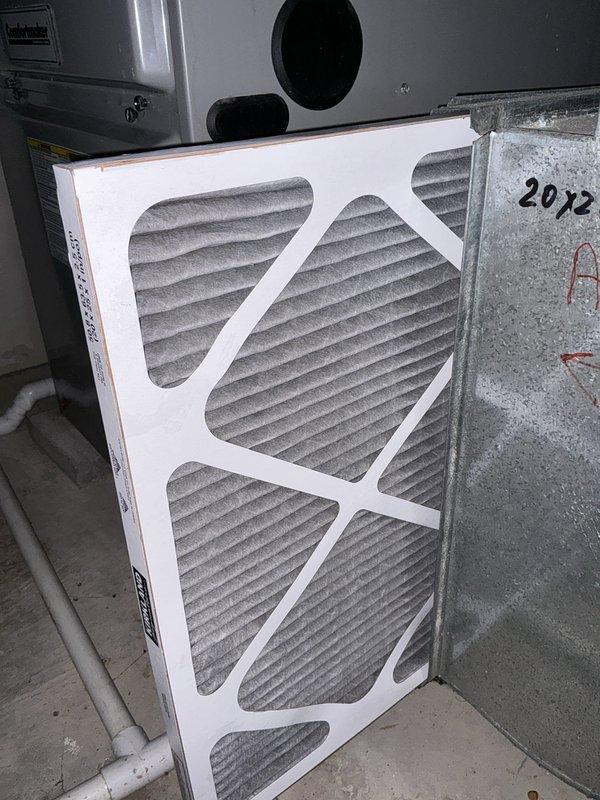 Completed HVAC estimate for air conditioning system replacement at residential property. Evaluated existing Amana condenser unit located on exterior concrete pad with standard landscaping clearance, assessed indoor air handler components including filtration system with 20x25 pleated filter showing normal usage and dust accumulation. Provided replacement options for complete system upgrade with easy access confirmed for future installation.