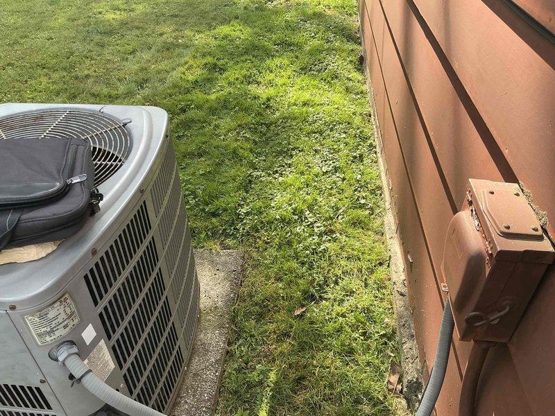 Provided HVAC system replacement estimate for easily accessible outdoor condenser unit. Evaluated existing equipment configuration including outdoor condensing unit with adequate clearance and current dual-zone thermostat control system. Presented multiple equipment options for complete system replacement to address aging equipment concerns.