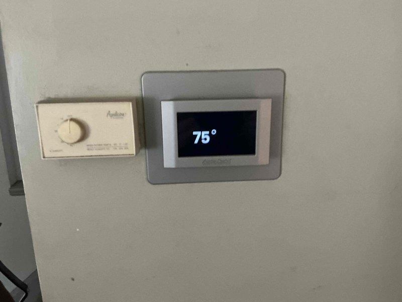 Provided HVAC system replacement estimate for easily accessible outdoor condenser unit. Evaluated existing equipment configuration including outdoor condensing unit with adequate clearance and current dual-zone thermostat control system. Presented multiple equipment options for complete system replacement to address aging equipment concerns.