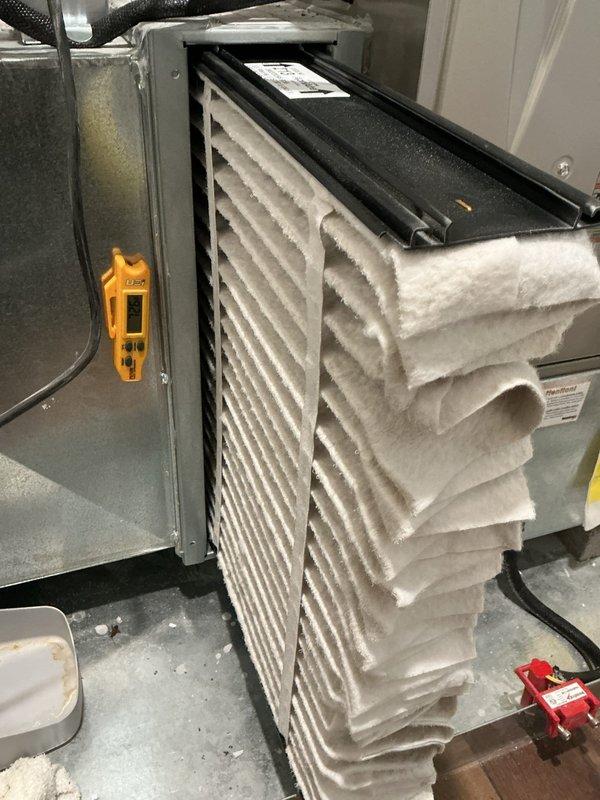 Performed cooling tune-up on Amana air handler system. Conducted electrical diagnostics using clamp meter, recording voltage and amperage readings to verify proper system operation. Inspected filter compartment and staged replacement filters for installation, ensuring optimal airflow and system efficiency.
