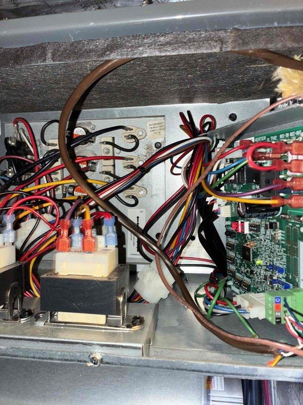 Completed scheduled cooling maintenance on residential HVAC system. Performed comprehensive inspection of outdoor condenser unit and internal control components, verified proper operation of circuit boards and electrical connections, checked refrigerant lines and system controls, and documented equipment condition with photos. All components found operating within normal parameters with no repairs required at this time.