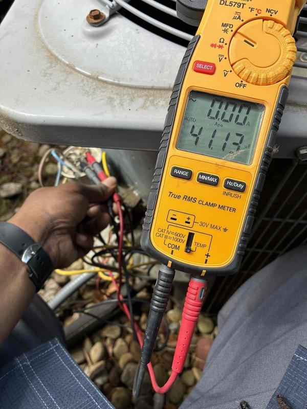 Performed preventive maintenance on two outdoor air conditioning condensing units. Conducted electrical diagnostics using digital multimeter and clamp meter, measuring voltage readings of 411.7V and verifying amp draw at 0.00A on system components. Inspected and tested all electrical connections, control boards, and wiring harnesses on both units to ensure proper operation for the cooling season.