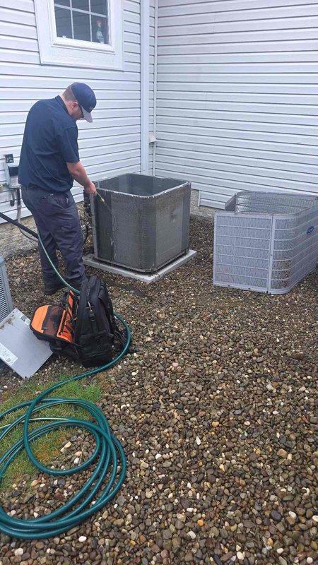 Returned to complete service call to replace two UV bulbs in the air purification system and finish cleaning of outdoor condensing units. Replaced bulbs in the AI Scrubber unit mounted on the indoor air handler, verified proper operation of the air purification system, and completed thorough cleaning of both outdoor AC units including coil cleaning and debris removal from the equipment pad area.