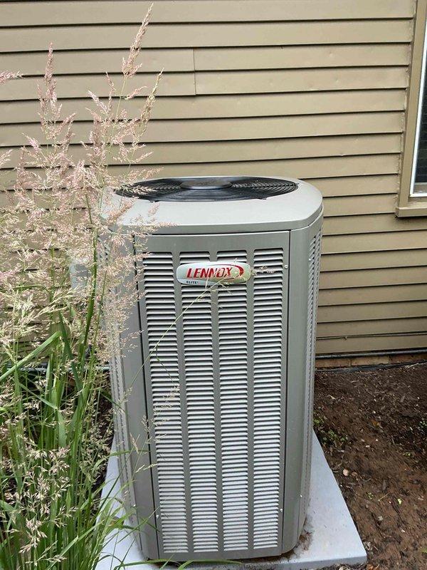 Performed routine maintenance on Lennox cooling system per MVP agreement. Customer reported unit operating properly but noted storm damage had occurred. Conducted thorough inspection of outdoor condenser unit, which showed normal weathering but no visible structural damage to cabinet, coil louvers, or fan assembly. Verified unit mounted securely on concrete pad with adequate clearance. Inspected interior components including condensate drainage system with PVC P-trap configuration, confirming proper installation and function. All mechanical and electrical components found in satisfactory working condition at time of service.