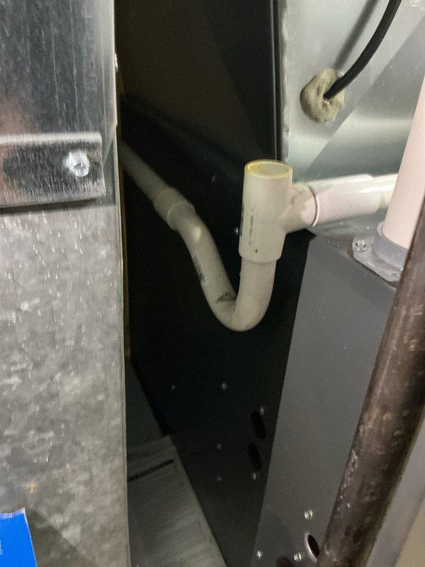 Performed routine maintenance on Lennox cooling system per MVP agreement. Customer reported unit operating properly but noted storm damage had occurred. Conducted thorough inspection of outdoor condenser unit, which showed normal weathering but no visible structural damage to cabinet, coil louvers, or fan assembly. Verified unit mounted securely on concrete pad with adequate clearance. Inspected interior components including condensate drainage system with PVC P-trap configuration, confirming proper installation and function. All mechanical and electrical components found in satisfactory working condition at time of service.