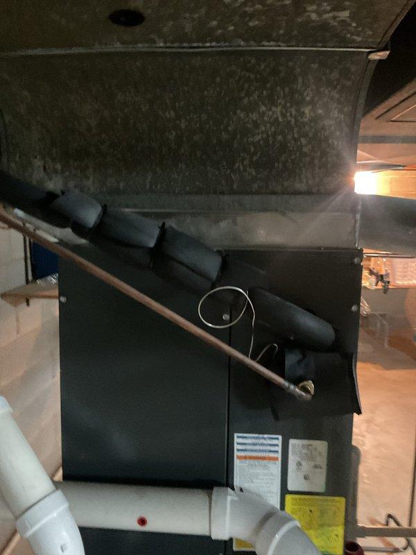 Completed HVAC cooling maintenance on system. Inspected ductwork and identified significant dark discoloration and potential mold growth on metal plenum surfaces, indicating moisture intrusion issues that require attention. Measured supply air temperature at 53.5°F, confirming system is producing adequate cooling output. Documented conditions with photos for customer review and recommended addressing ductwork contamination and investigating moisture source to prevent further deterioration and maintain indoor air quality.