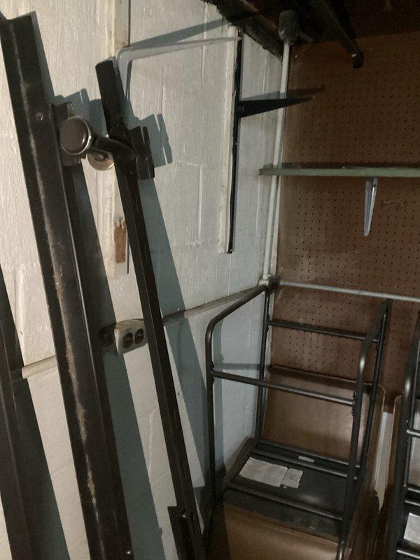 Conducted comprehensive electrical inspection of residential utility space and storage area. Evaluated electrical panel, conduit installations, and wire routing systems for code compliance and safety standards. Documented existing conditions including metallic flexible conduits, multi-circuit wiring configurations, and junction box connections. Photographed electrical infrastructure showing proper conduit entry points and wire management throughout mechanical room. Verified structural mounting of electrical components and assessed overall system integrity.