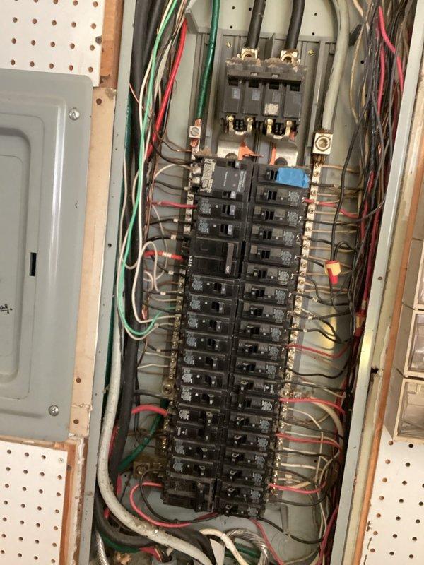 Conducted comprehensive electrical estimate for EV charger installation at residential property. Evaluated existing electrical infrastructure including main service panel with dual-column breaker configuration and exterior generator system with associated conduit routing. Assessed panel capacity, available breaker spaces, and optimal circuit routing for dedicated EV charging circuit installation, photographing current electrical setup to determine equipment and material requirements for future charging station implementation.