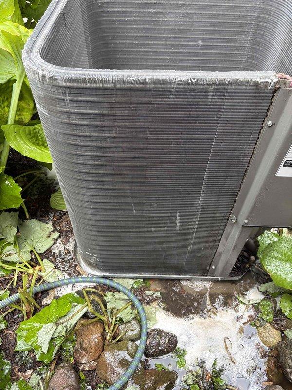Performed deep cleaning of outdoor condenser coil which had accumulated significant organic debris including leaves, twigs, and decomposed plant matter around the base and within the unit enclosure. Thoroughly cleaned condenser fins, removed all debris from equipment housing, and restored proper airflow to heat exchanger coils to ensure optimal system performance and efficiency.