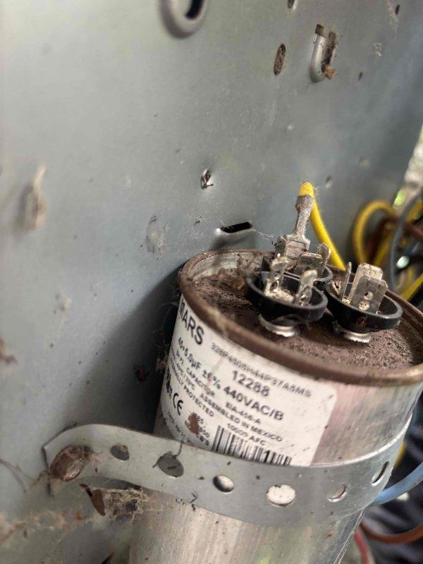 Completed comprehensive cooling system tune-up on residential HVAC unit. Inspected and serviced all major components including condenser unit, evaporator coil, and electrical connections. Noted significant corrosion on capacitor terminals and mounting hardware, indicating prolonged moisture exposure; capacitor remains functional but will require monitoring for future replacement. Verified system airflow, checked refrigerant levels, cleaned accessible components, and confirmed proper operation of all safety controls and thermostat functionality.