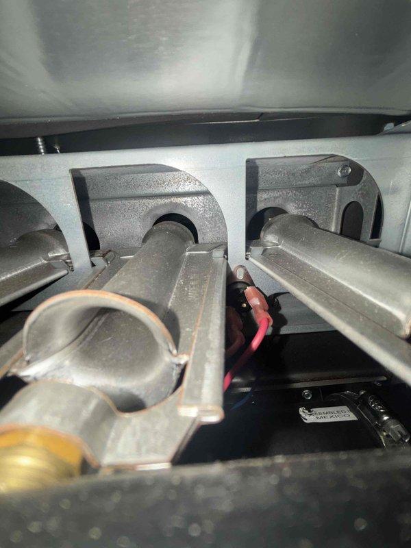 Completed routine cooling system maintenance as part of ongoing preventive maintenance program. Technician performed comprehensive inspection of AC unit components, including examination of refrigerant lines, mounting brackets, condensate drain system, and electrical connections. Internal compartment access was obtained to verify proper installation and condition of copper refrigerant lines secured with mounting clamps, and all connections were found to be secure with no visible refrigerant leaks detected. Condensate drain piping and PVC connections were inspected for proper drainage and blockages. All system components were functioning within normal operating parameters at time of service completion.
